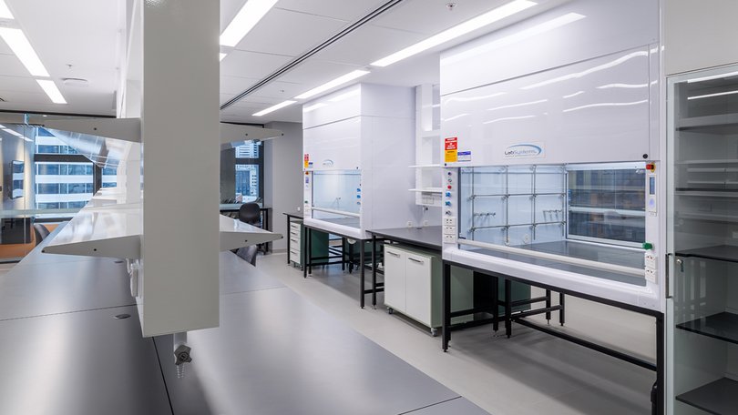 Open laboratory at ACMD with benches, fume hoods and bright interior.