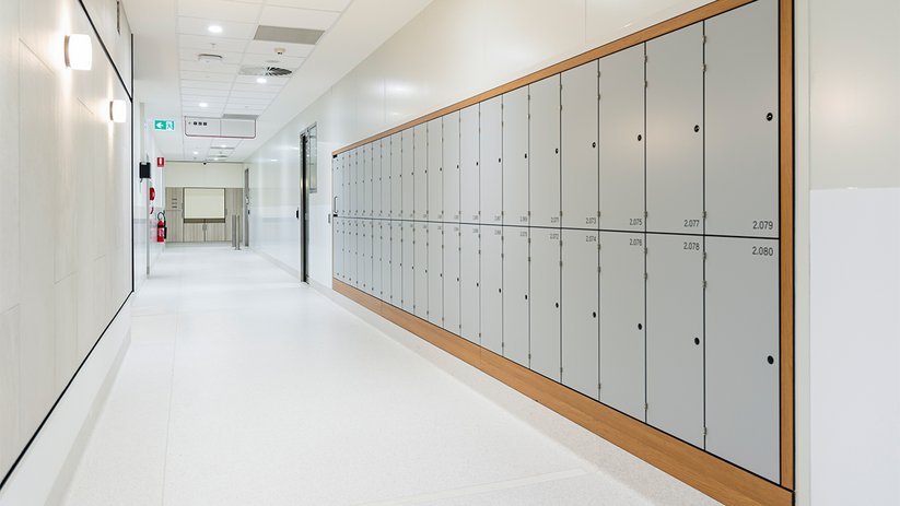 Corridor at CSL Melbourne with lockers and clean lines.
