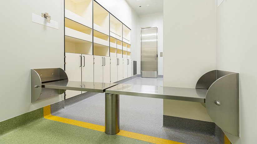 Functional lab area at CSL Melbourne with pass-through bench and storage.