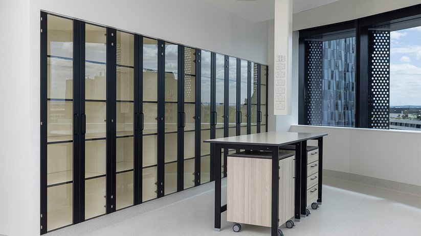 Laboratory at CSL Melbourne with tall cabinets and mobile bench.