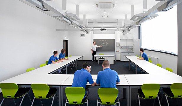 Instructor teaching in a flexible room layout