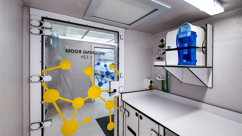 Compact lab room at the University of Otago with internal viewing window.