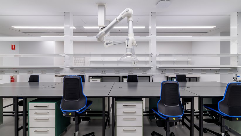 Laboratory at ACMD with workstations, shelving and extraction arms.