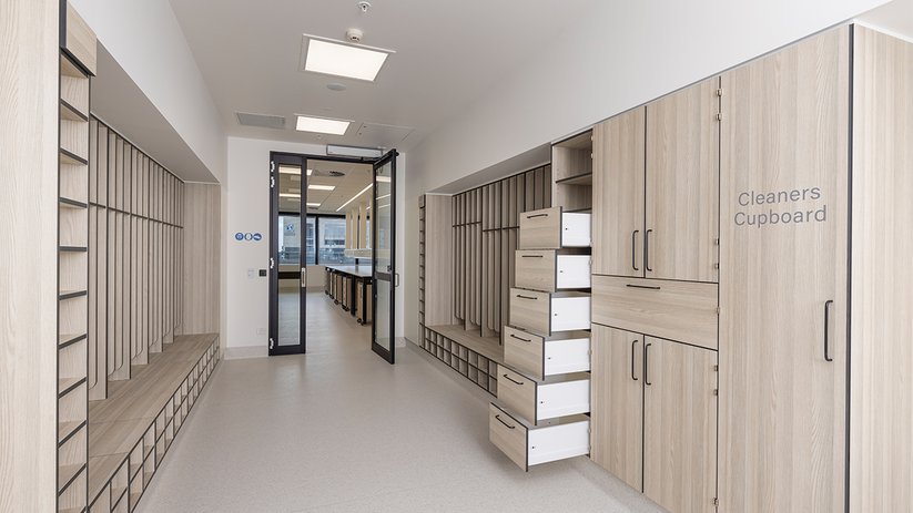 Corridor at CSL Melbourne with integrated storage and cabinets.