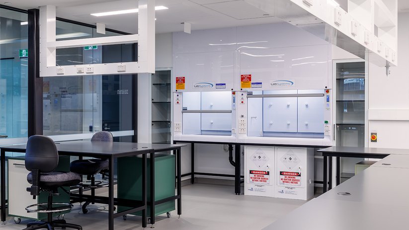Laboratory workspace at ACMD with fume hoods and bench seating.