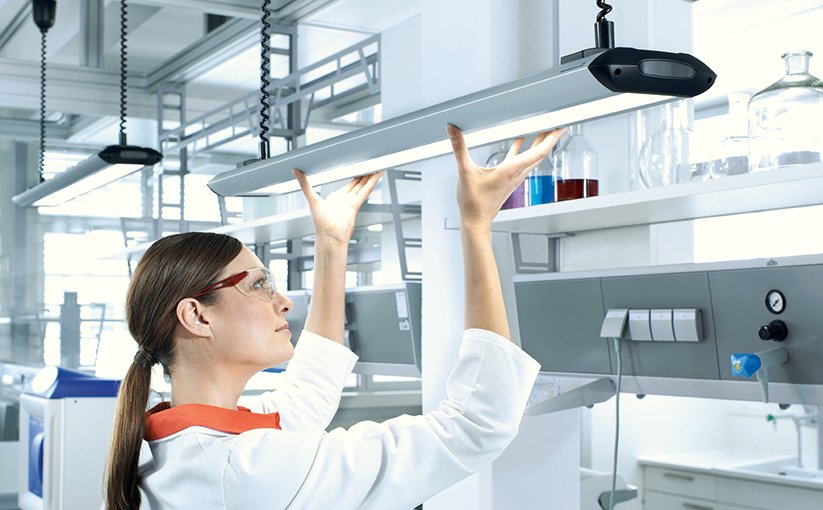 Person checks lighting in modern room