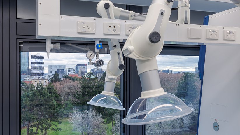 Lab extraction arm at ACMD in front of a window view.
