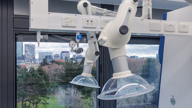 Lab extraction arm at ACMD in front of a window view.