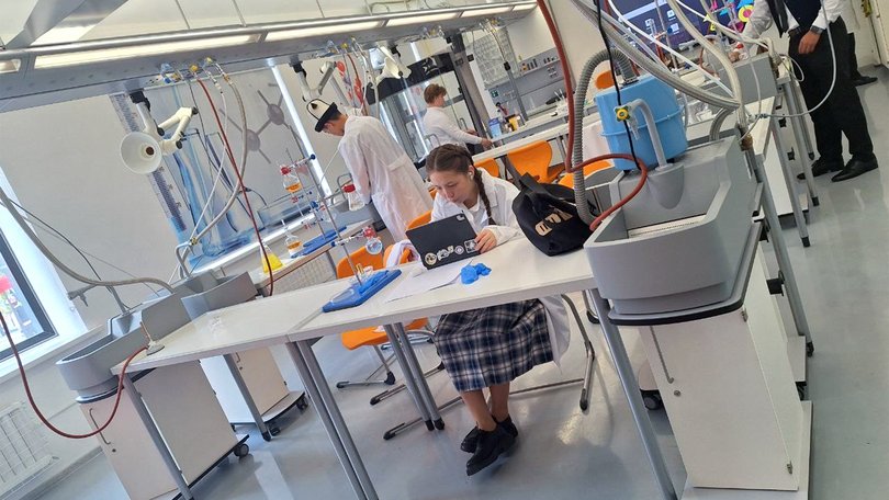 Pupils carry out experiments in a chemistry laboratory